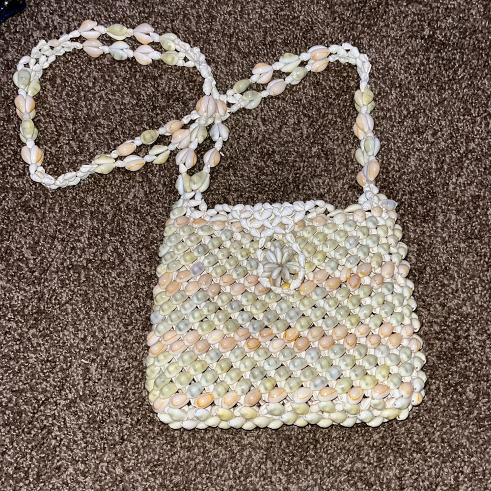 Small shoulder orange and green shell purse.